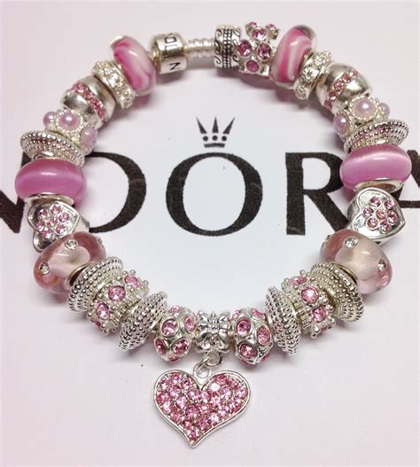 BEST SELLER. . Pink pandora bracelet with charms